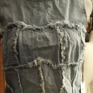 New,with tags,light blue frayed denim zip back sleeveless yoke top, size medium.